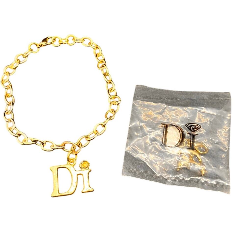DIAMONDS INTERNATIONAL "Di" GOLD‎ TONE LINK CHARM BRACELET AND Dolphin CHARM